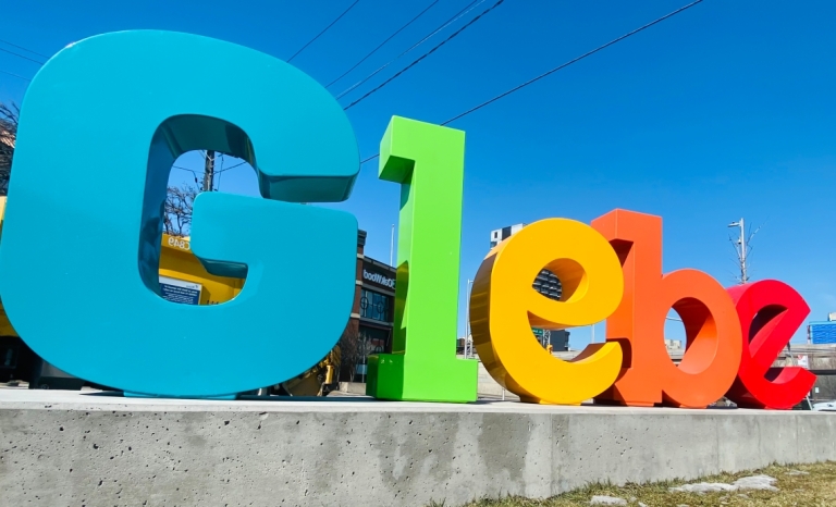 Large multi-coloured letters that says "Glebe"