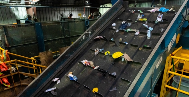 A conveyor belt at a recycling sorting facility