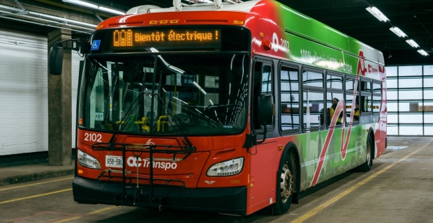 An OC Transpo electric bus on display in the garage