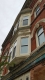 Somerset House is located at the corner of Bank Street and Somerset Street in the Centretown Heritage Conservation District. The building is red brick and features elaborate decorative metal details.